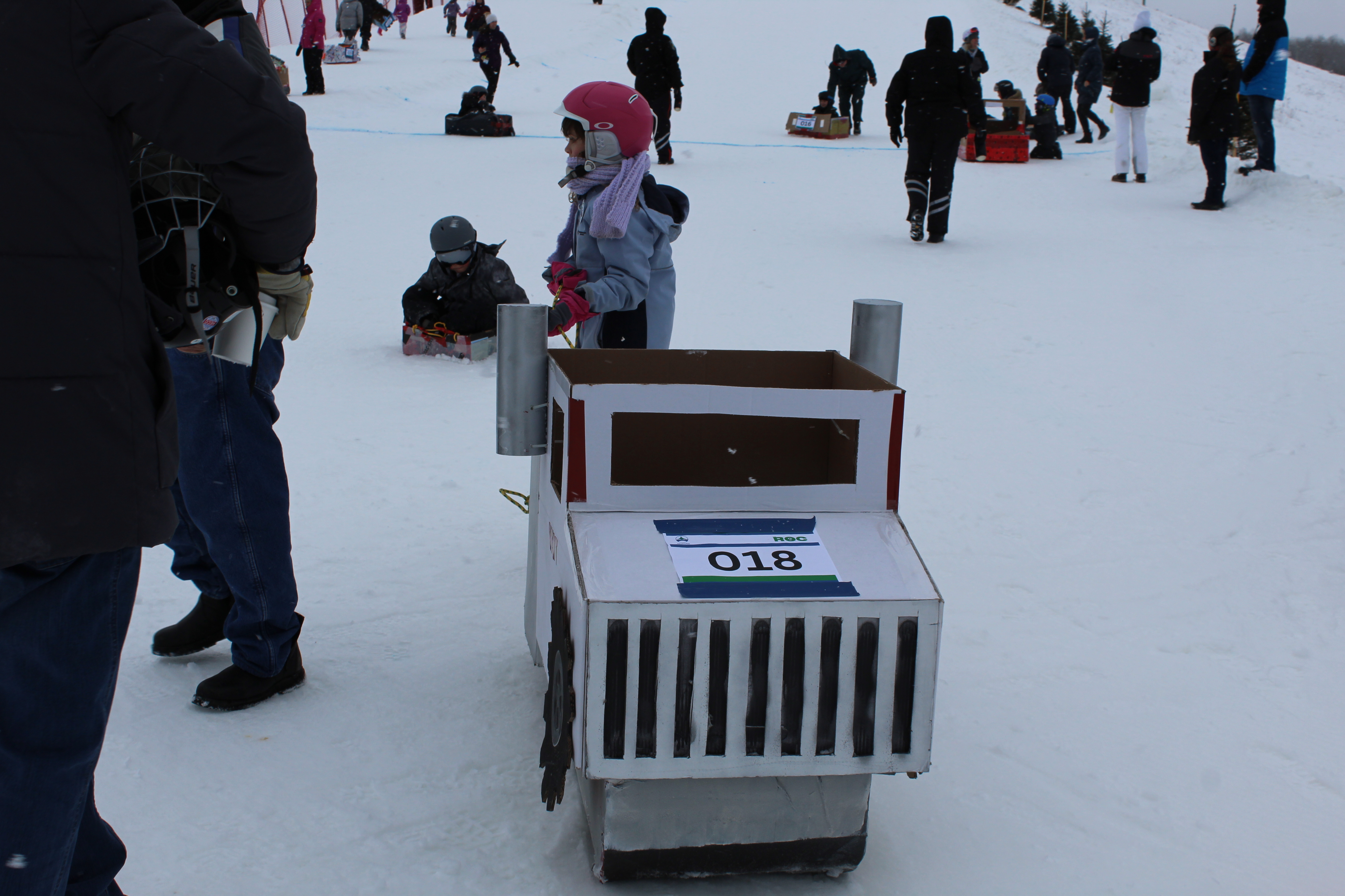 homemade cardboard toboggan shaped like an 18-wheeler truck