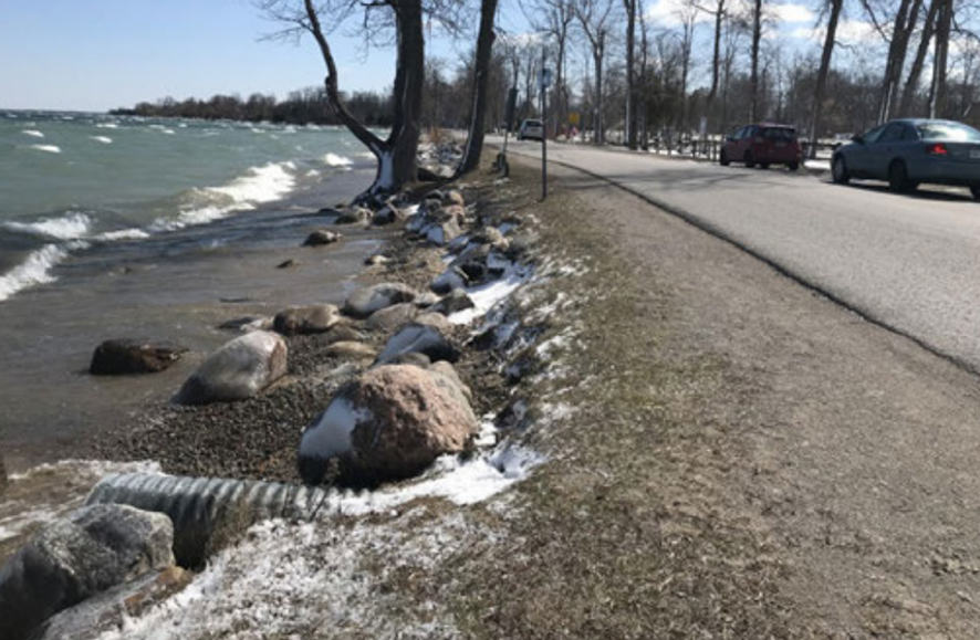 Lakeside road next to narrow beach