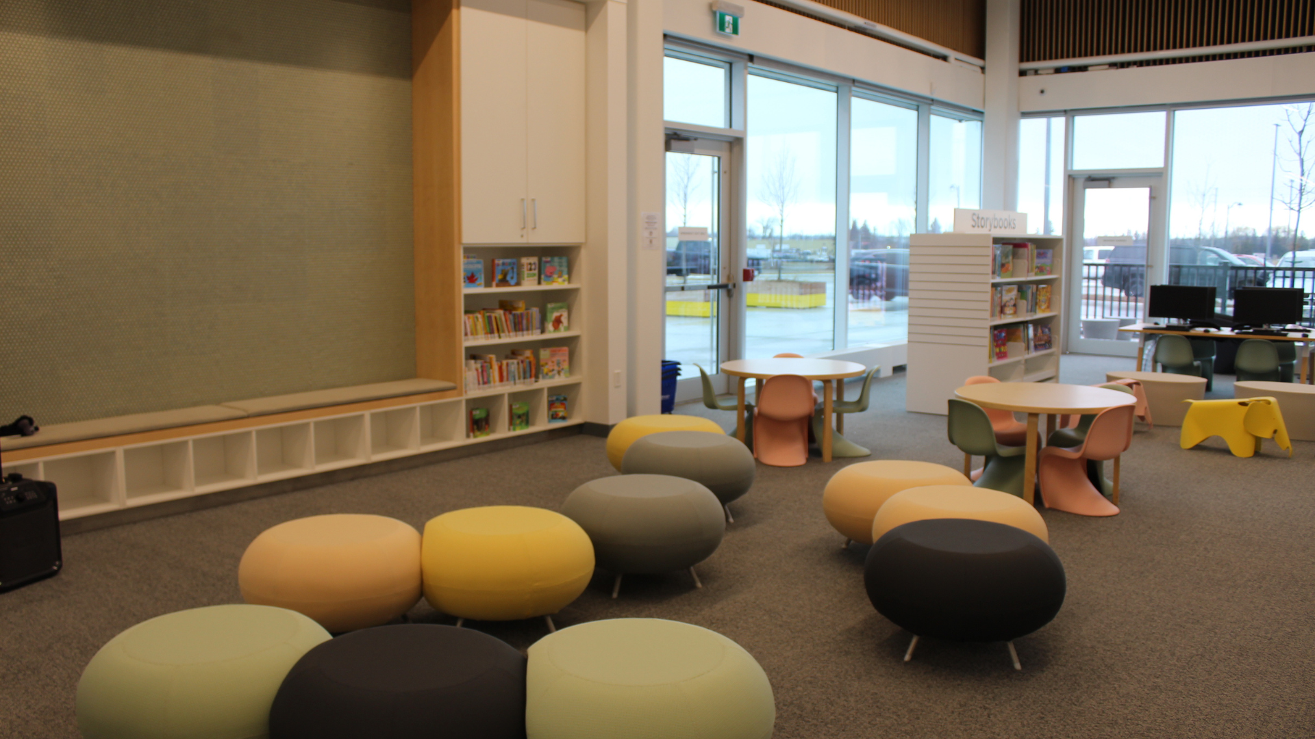 Library room with colourful fabric puff seating