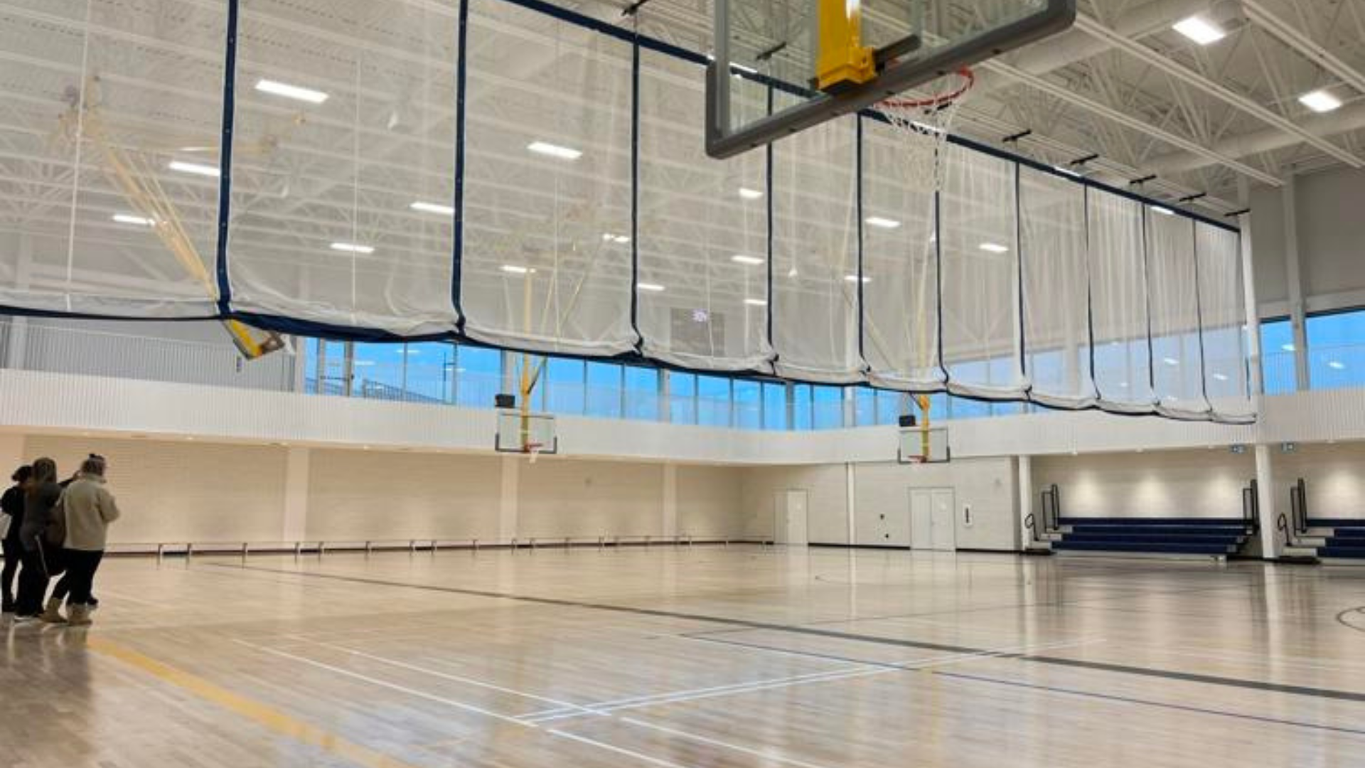 Empty Gymnasium with Fabric curtain coming down