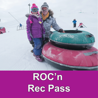 parent and child in winter gear next to two tubes with the words ROC'n Rec Pass