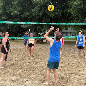 Group of people playing beach volleyball