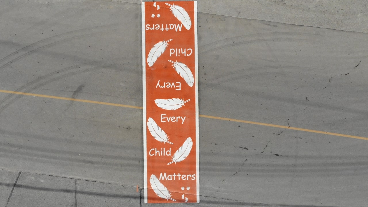 Every Child Matters Crosswalk Orange crosswalk says every child matters with feathers, handprints and footprints