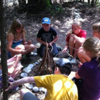 children sitting on the ground