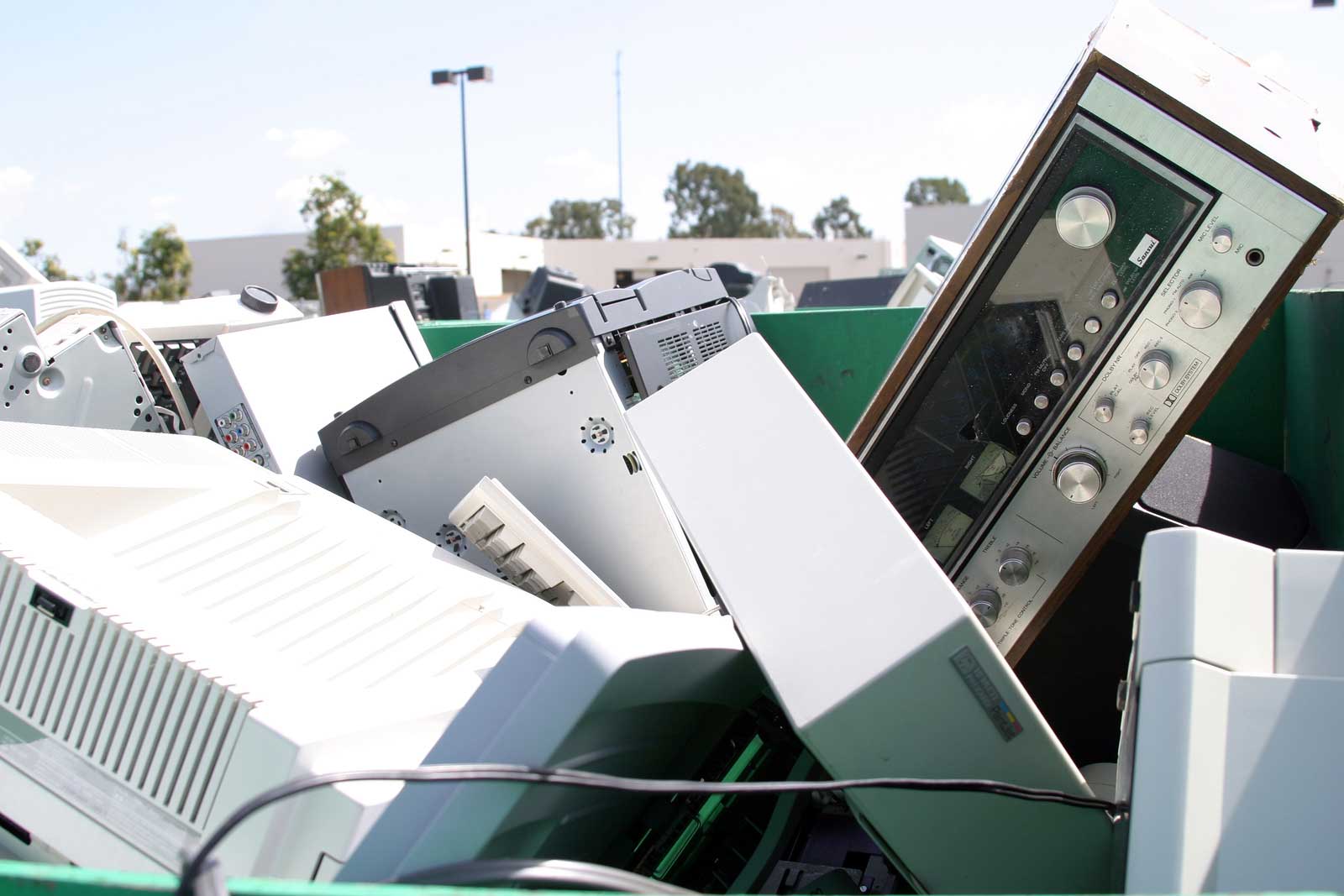 Old electronics in a dumpster