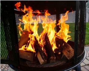 Open Air Burning fire burning in a chiminea on a patio