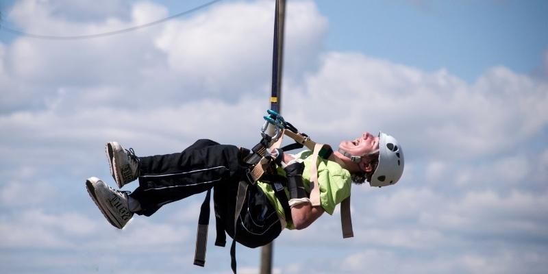 Person in reverse zipline in action