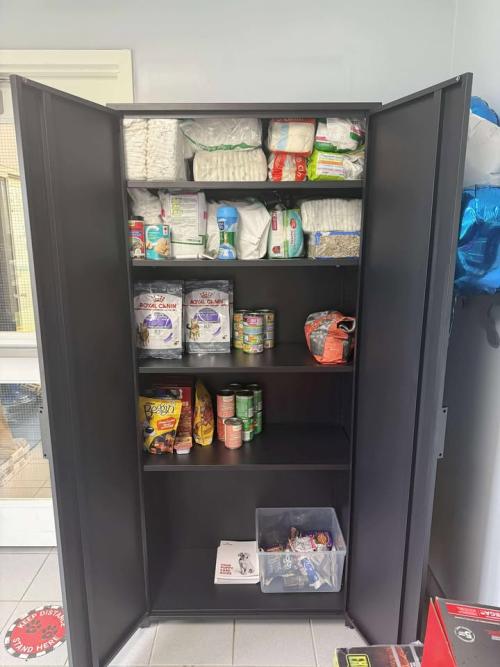 half full pantry with animal food and supplies