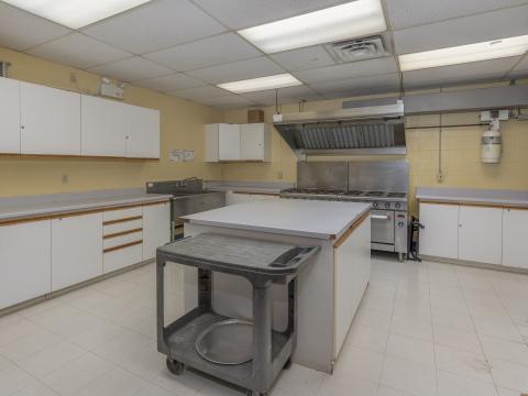 Kitchen area with stove and counters