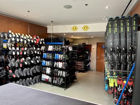 Ski and snowboard Boots and skis and a counter