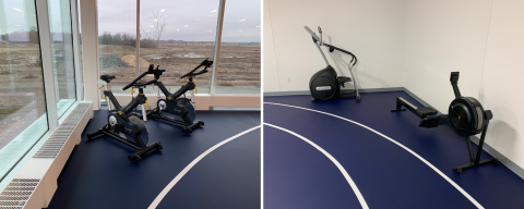 left 2 cycling machines in front of windows right a stair master and a rower in a corner