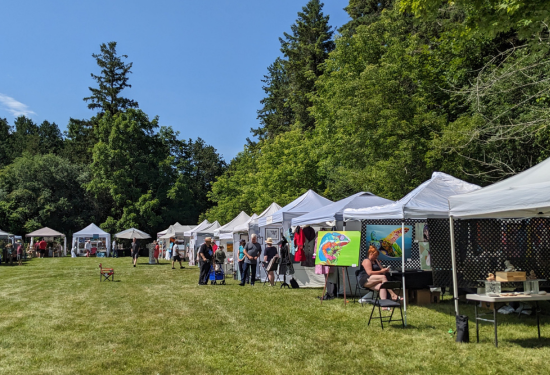 series of tents with art hanging