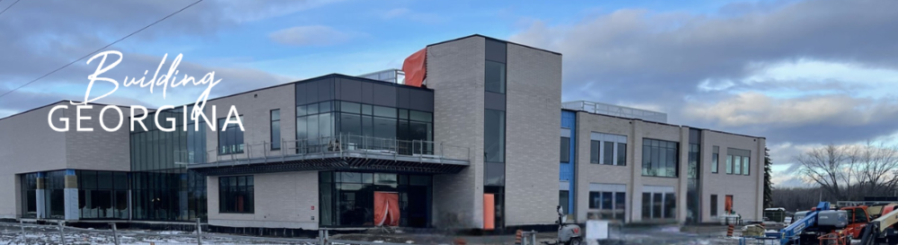 Building under construction almost complete with the words Building Georgina