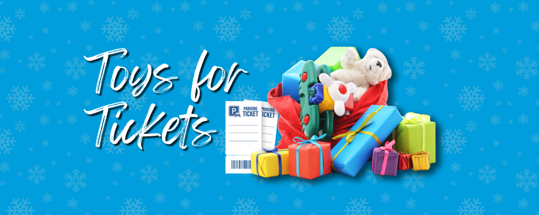 pile of gifts in a large red sack with toys spilling out and the words Toys for Tickets
