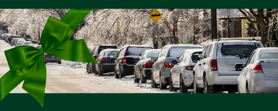 cars parked on a street single file 