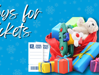 pile of gifts in a large red sack with toys spilling out and the words Toys for Tickets