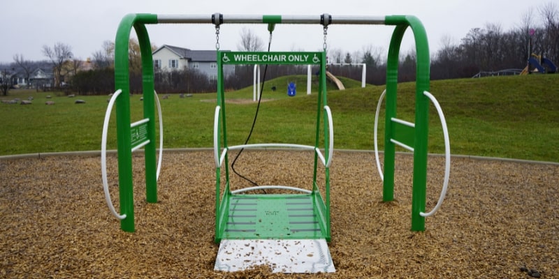 Wheelchair accessible swing in a playground